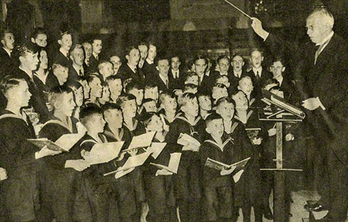 Der Thomanerchor und Karl Straube während einer Gastspielreise, Presse-Foto (undatiert). Landesbibliothek Mecklenburg-Vorpommern, Schwerin.